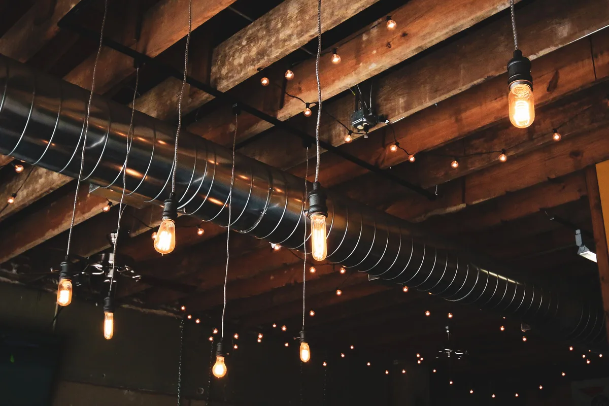 Spiral metal air duct run along a ceiling